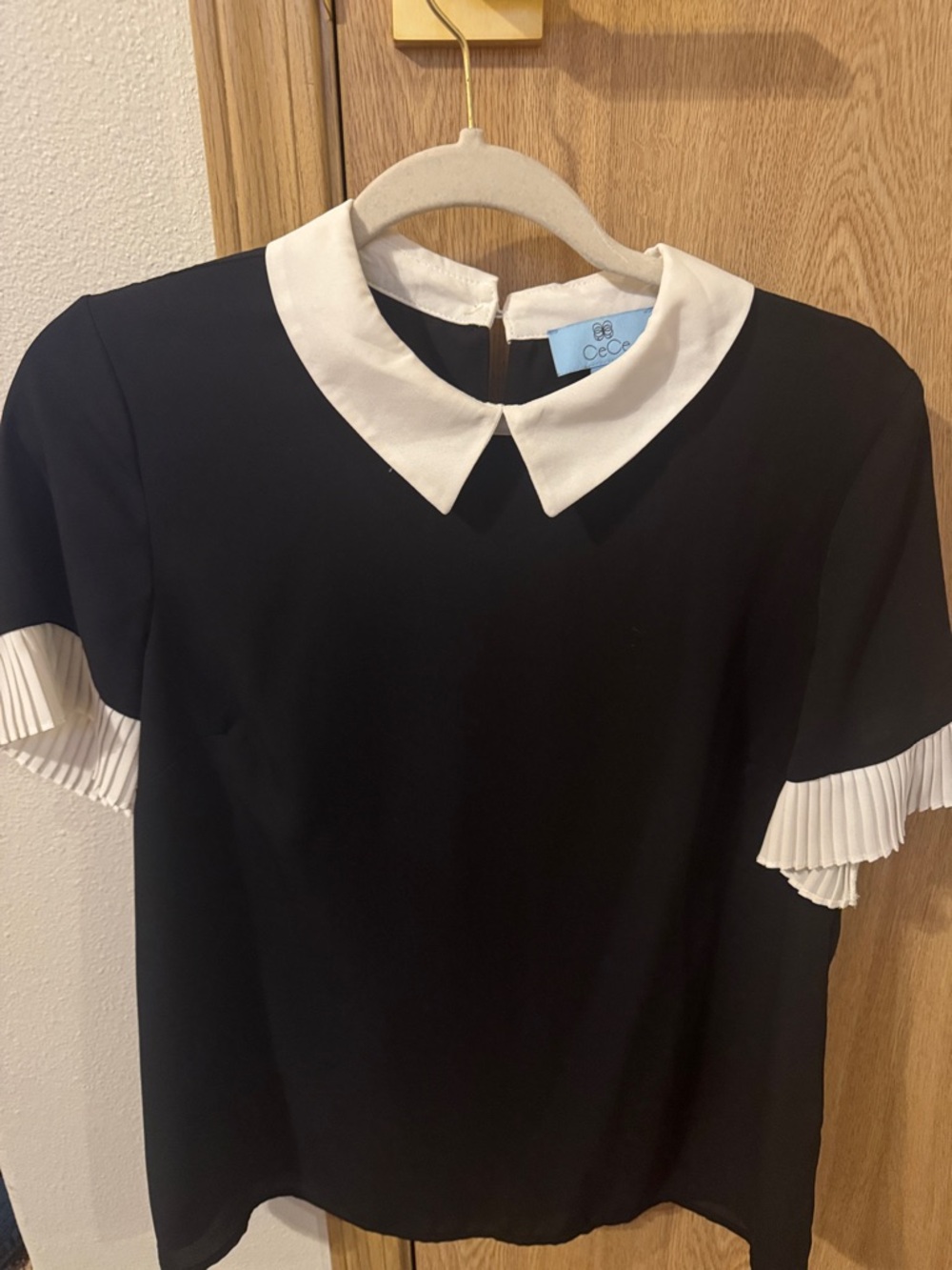 CeCe Black Blouse with White Peter Pan Collar and Pleated Sleeve Trim